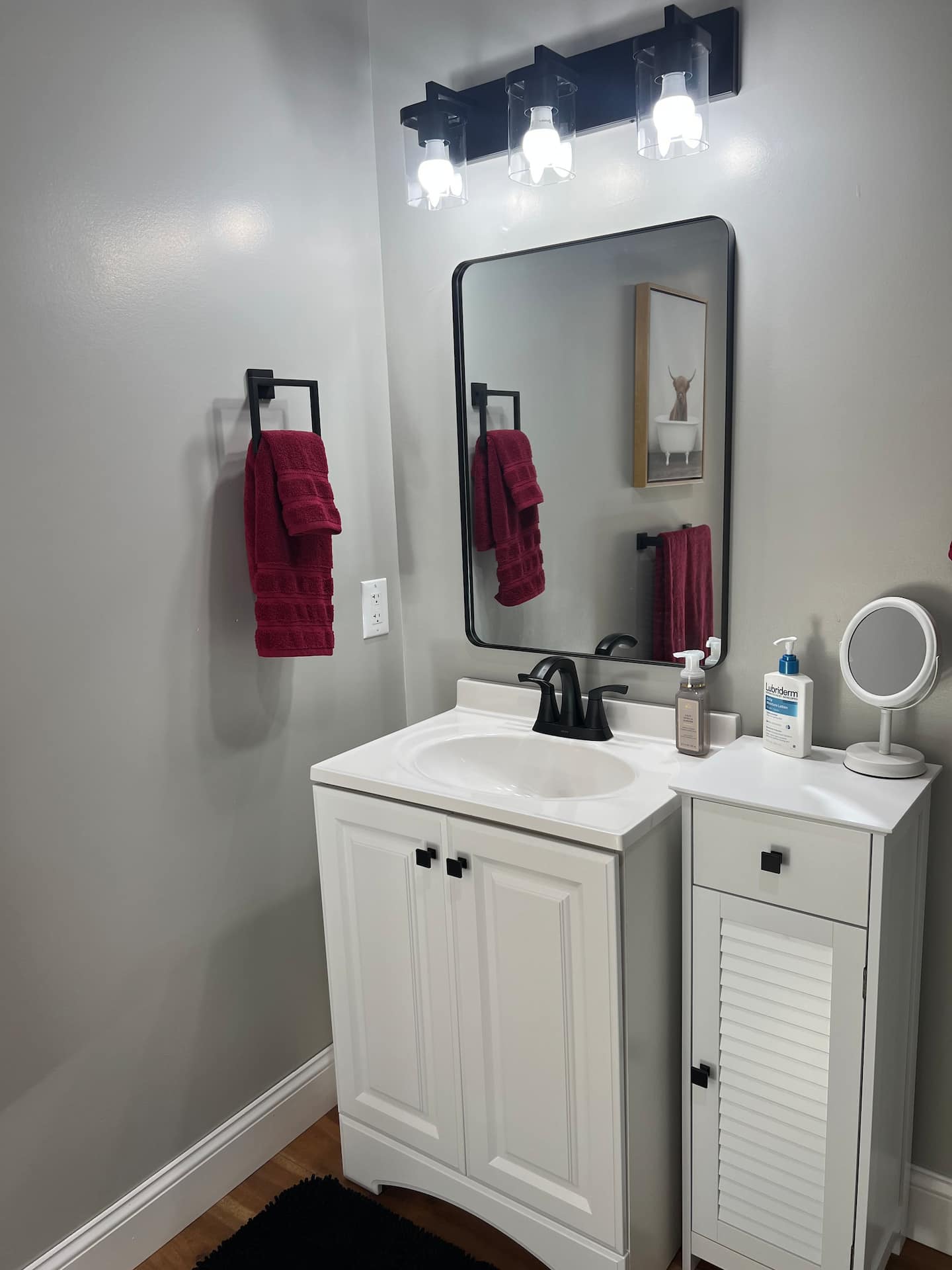 Full bathroom with vanity and mirror